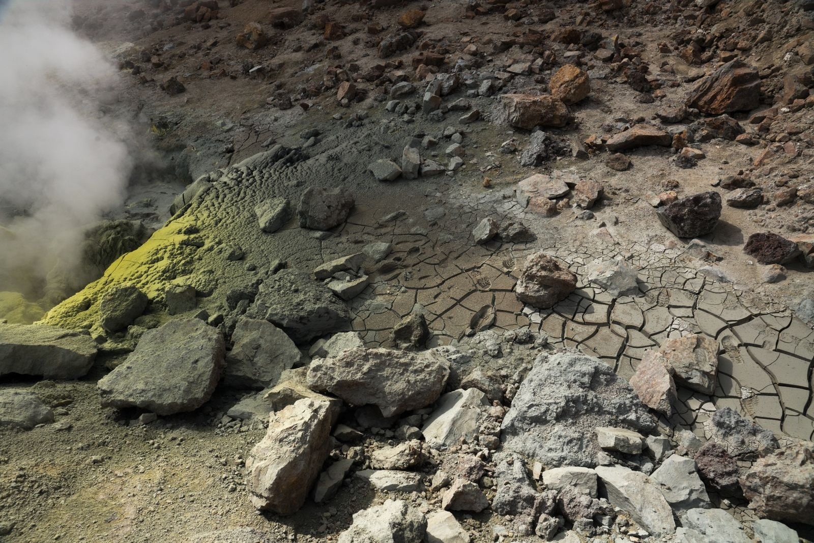Natural sulphur deposits on rocks